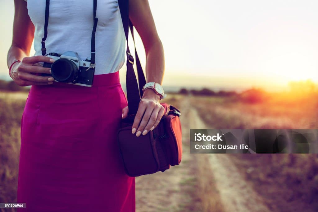 A camera with its suitcase.