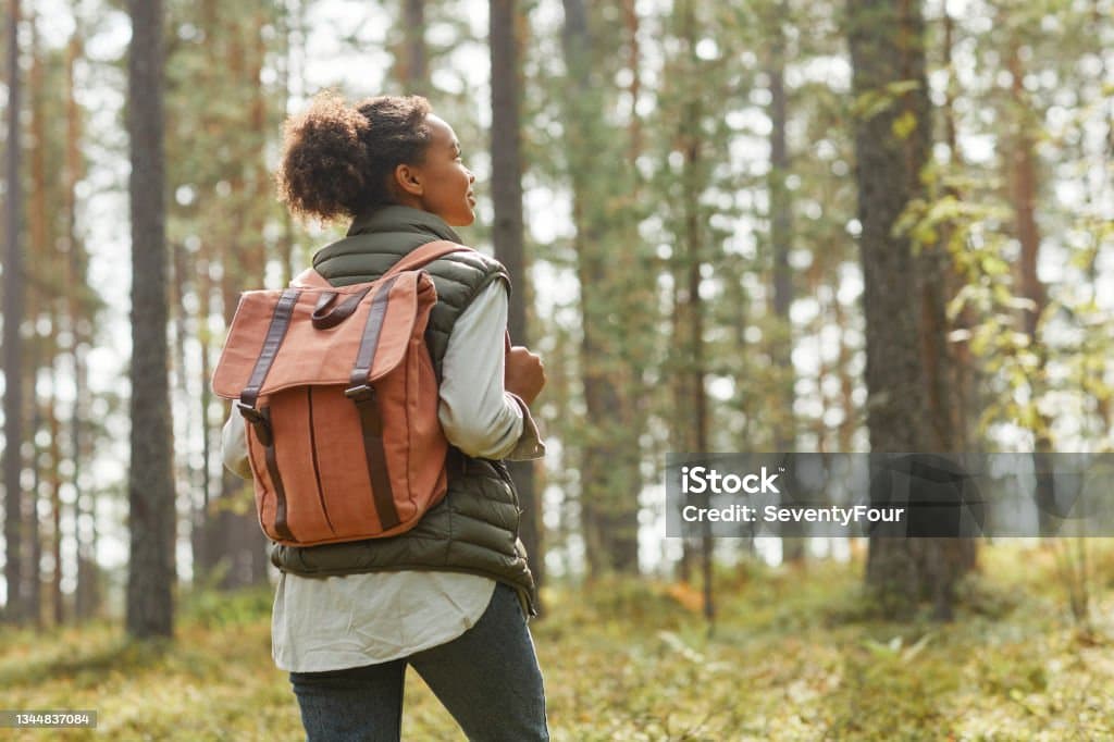 A female student enjoys her bag.