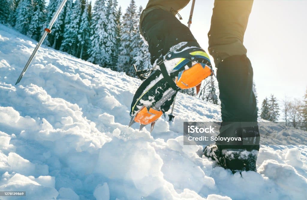 Walking with huge snow boots.